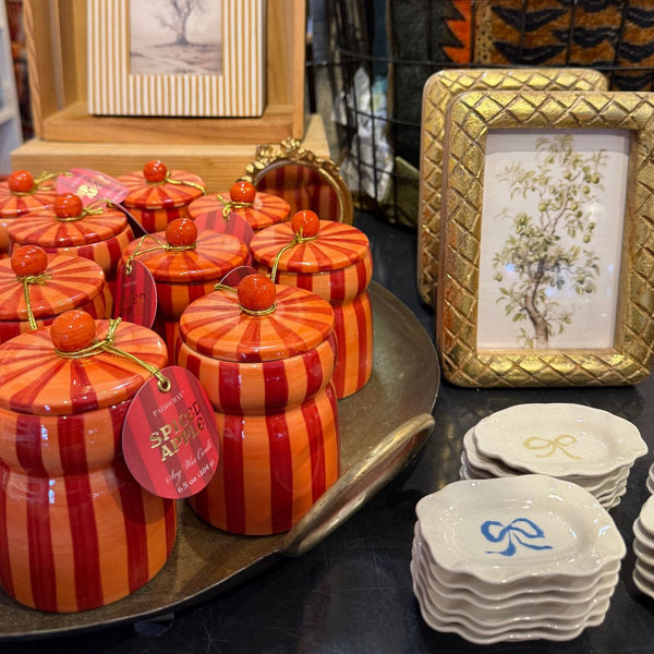 Candles, picture frames, small trays with hand painted bows.