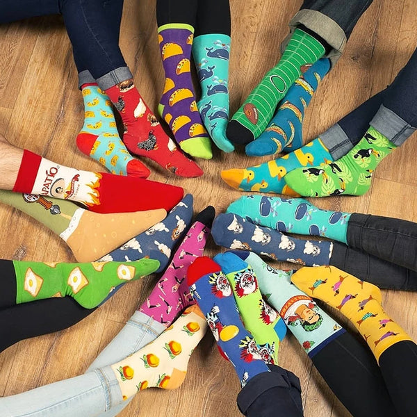 Circle of people wearing colorful socks