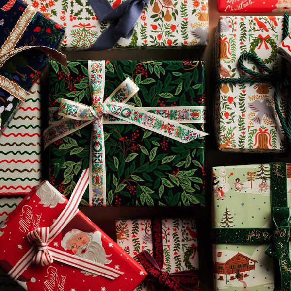 Wrapped gifts with graphic paper and ribbon.