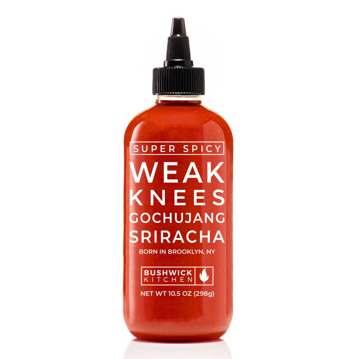 A bottle of Bushwick Kitchen Weak Knees Gochujang Sriracha, featuring a translucent red-orange sauce inside a clear bottle with a black cap, on a white background.