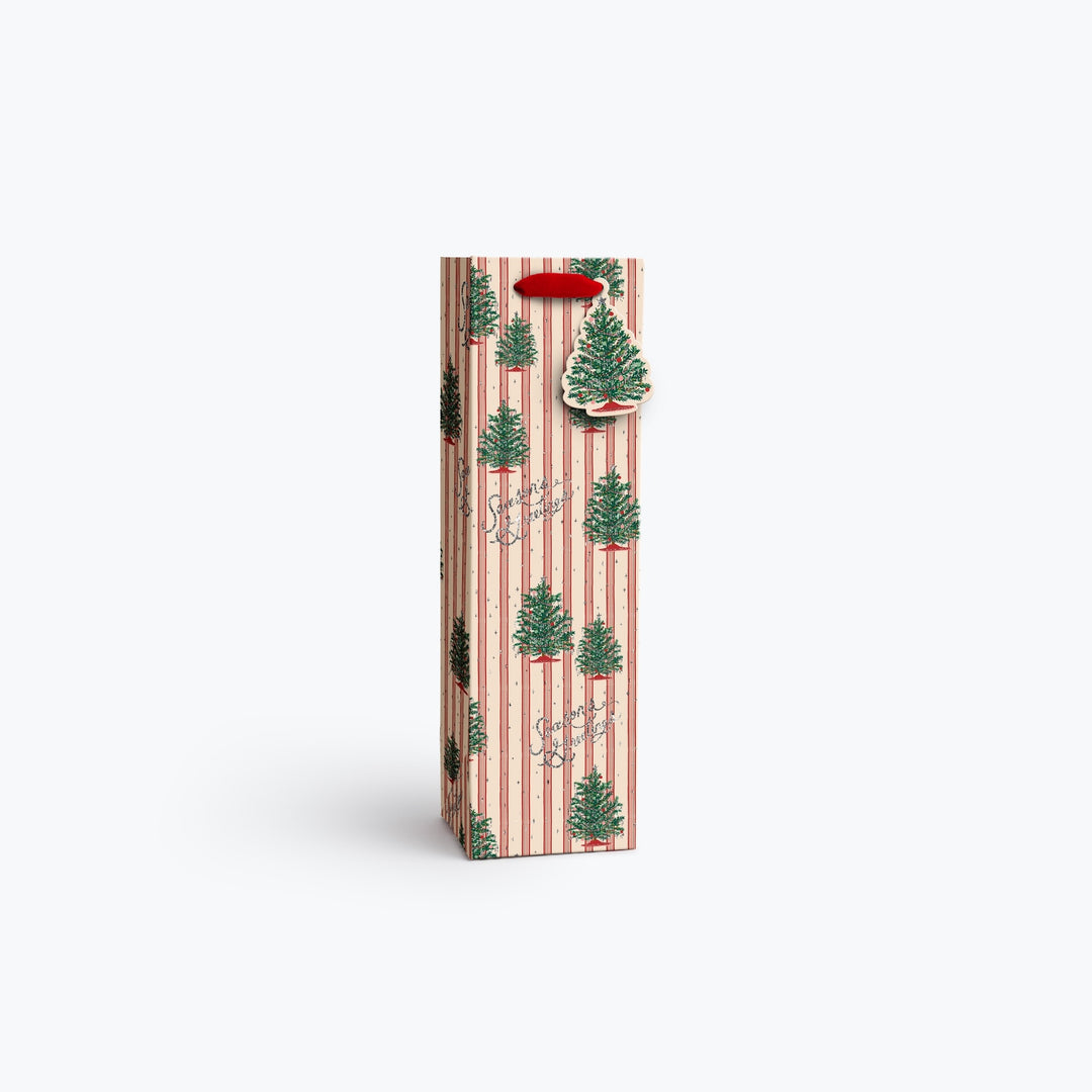 A tall, narrow gift bag or packaging sleeve with a festive Christmas pattern of green pine trees on a pink and white striped background, featuring a red hanging loop at the top, set against a plain white studio background.