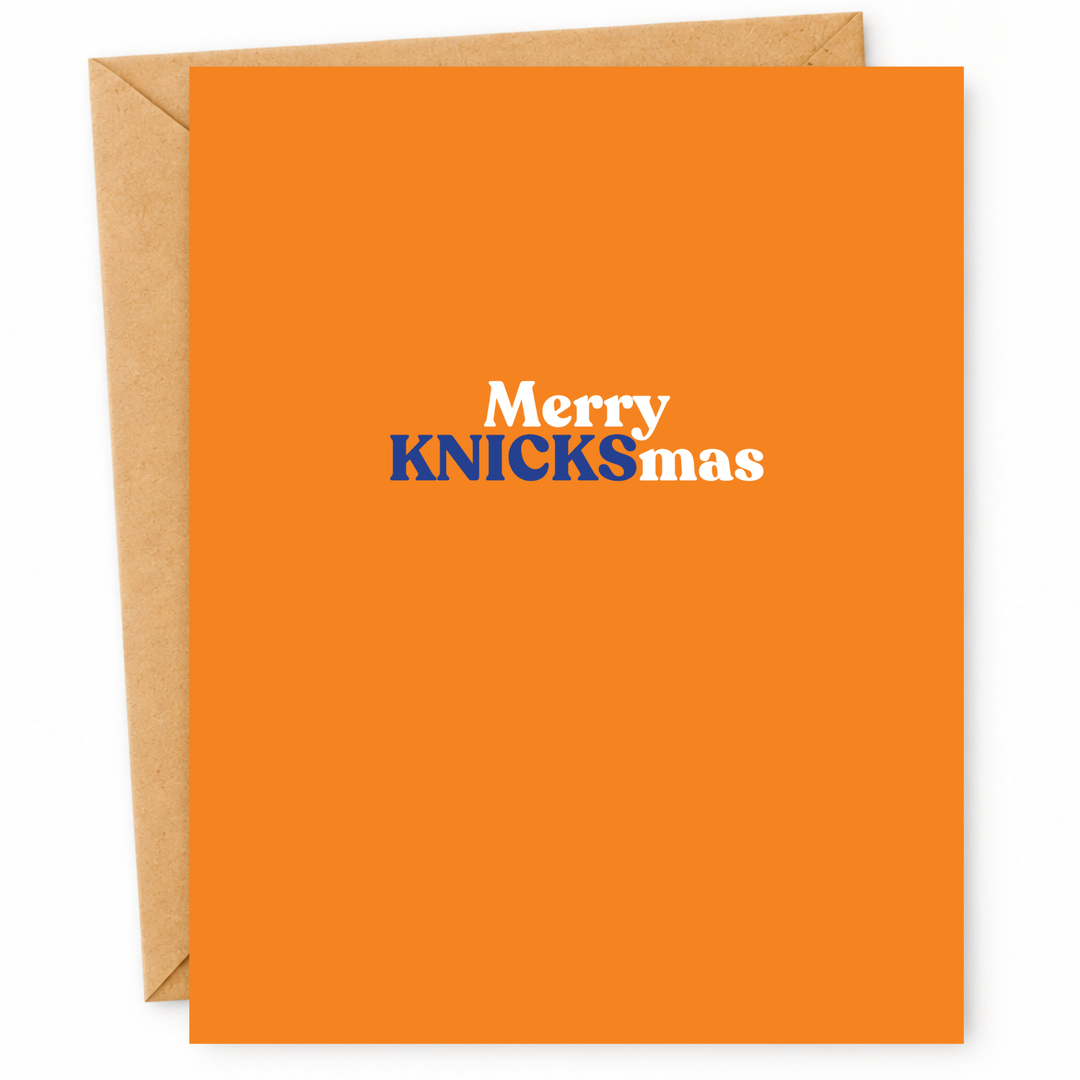 An orange greeting card with a brown kraft envelope behind it. The card has the text &