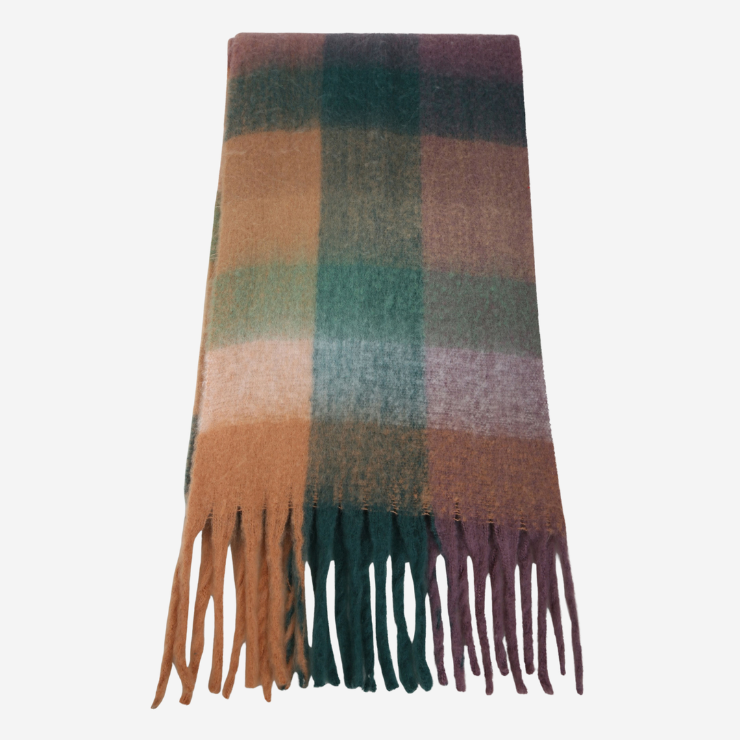A soft woven scarf with a plaid pattern in muted earthy tones, featuring a gradient of brown, teal green, and plum purple, finished with fringe tassels at the bottom, shown against a plain light gray background.