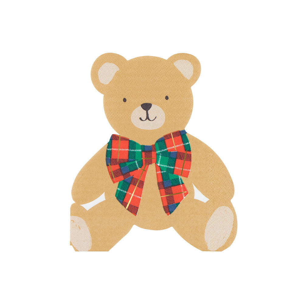 A teddy bear illustration or sticker in tan with a red, green, and blue plaid bow tie, centered on a plain white background.