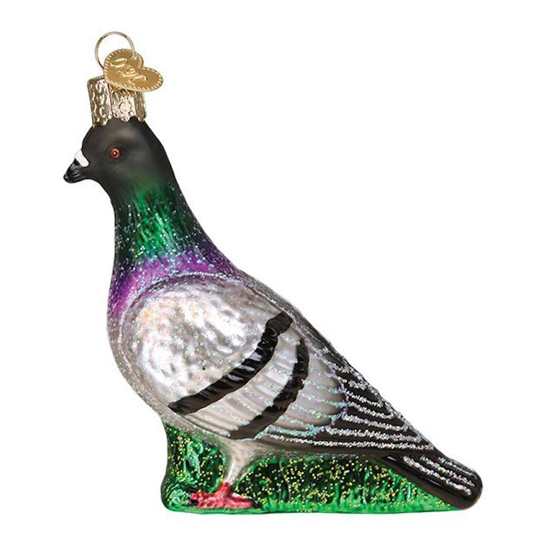 Glass pigeon ornament on a white background