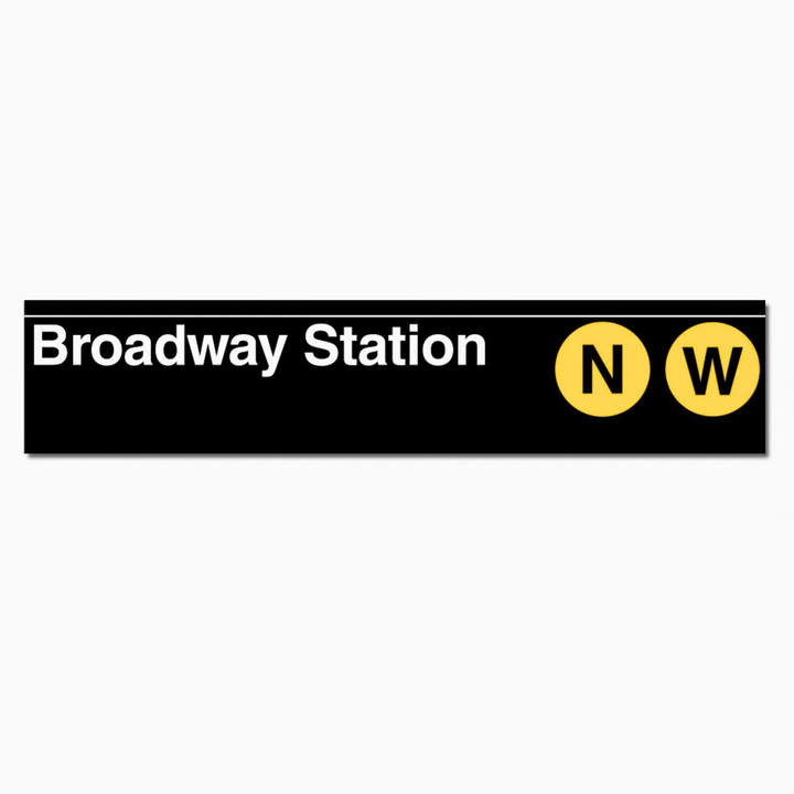 A rectangular black sign or sticker reading &