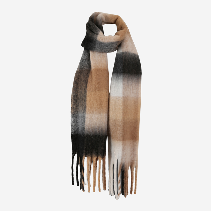 A soft plaid scarf with a gradient ombre effect transitioning from black at the top to beige and cream, finished with fringed ends, shown on a plain light gray background.
