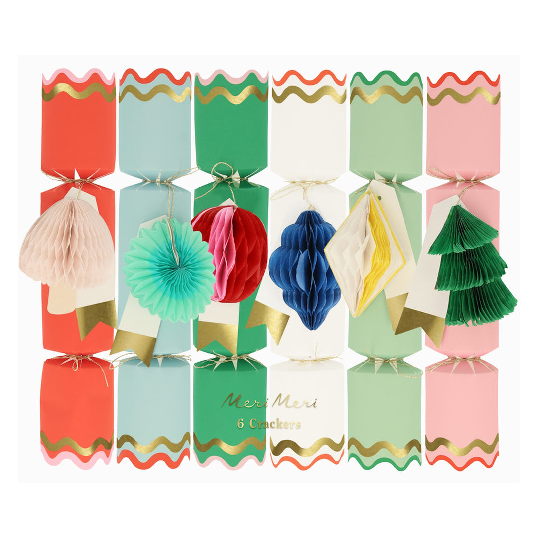 Colorful Christmas crackers with decorative elements on a white background
