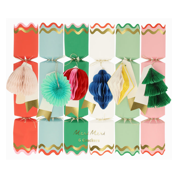 Colorful Christmas crackers with decorative elements on a white background