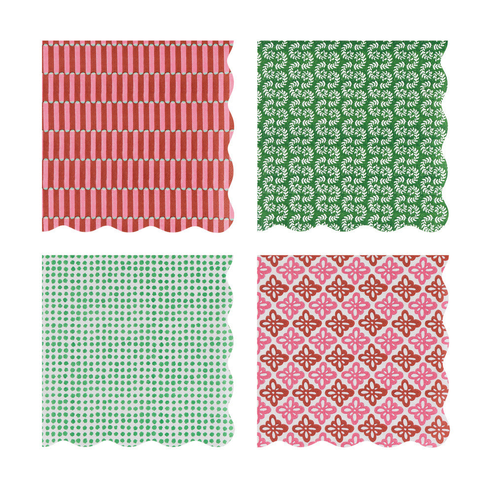 Four square fabric napkins with scalloped edges arranged in a 2x2 grid on a white background. The top-left napkin has vertical red and white stripes, the top-right has a green and white floral pattern, the bottom-left has green polka dots on a white background, and the bottom-right has a pink and rust geometric pattern.
