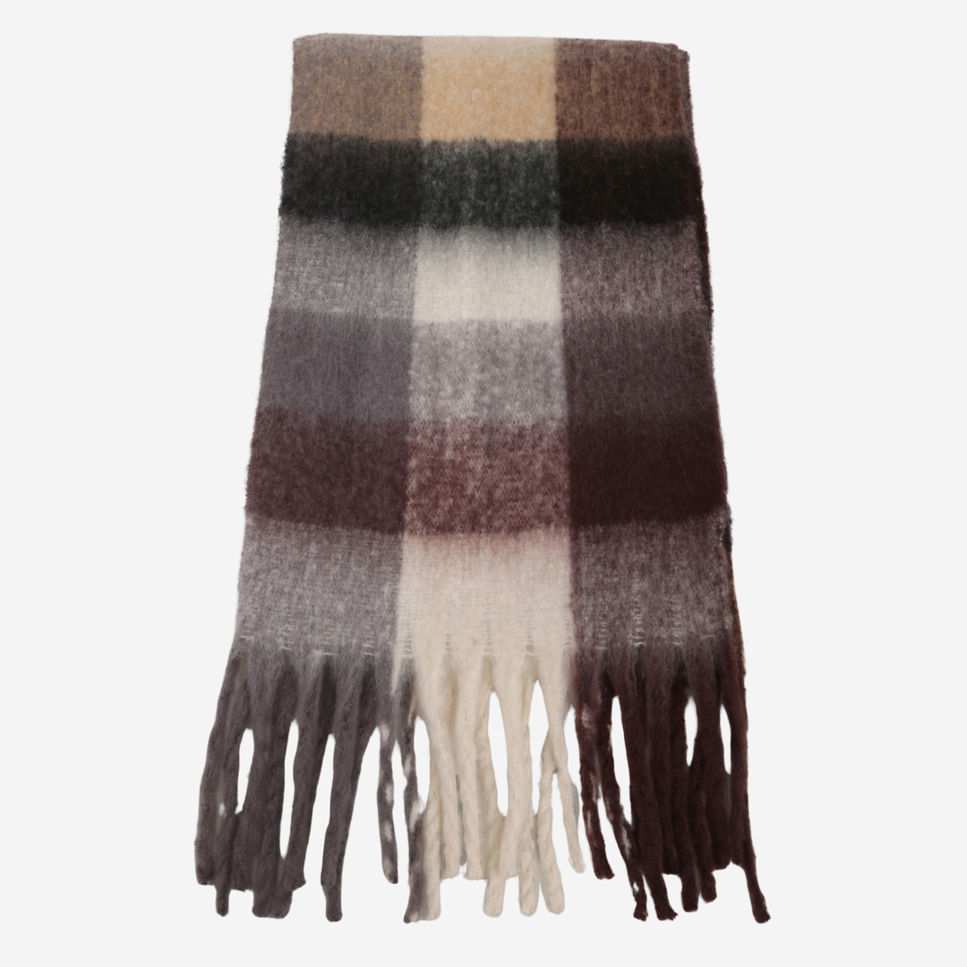 A folded plaid scarf with fringe tassels  in neutral tones of beige, brown, gray, and black, styled against a soft grey background.