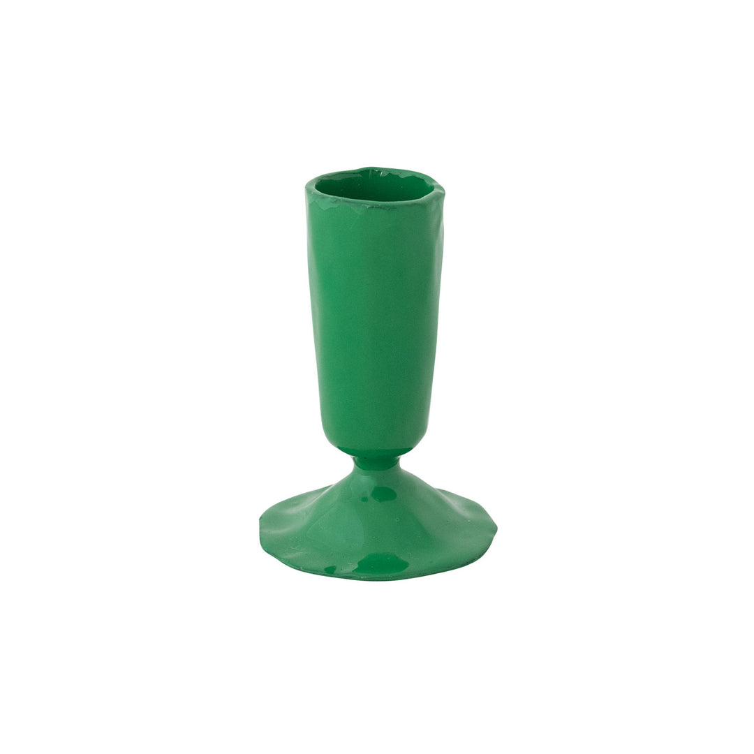 Green plastic cup with a wide base on a white background