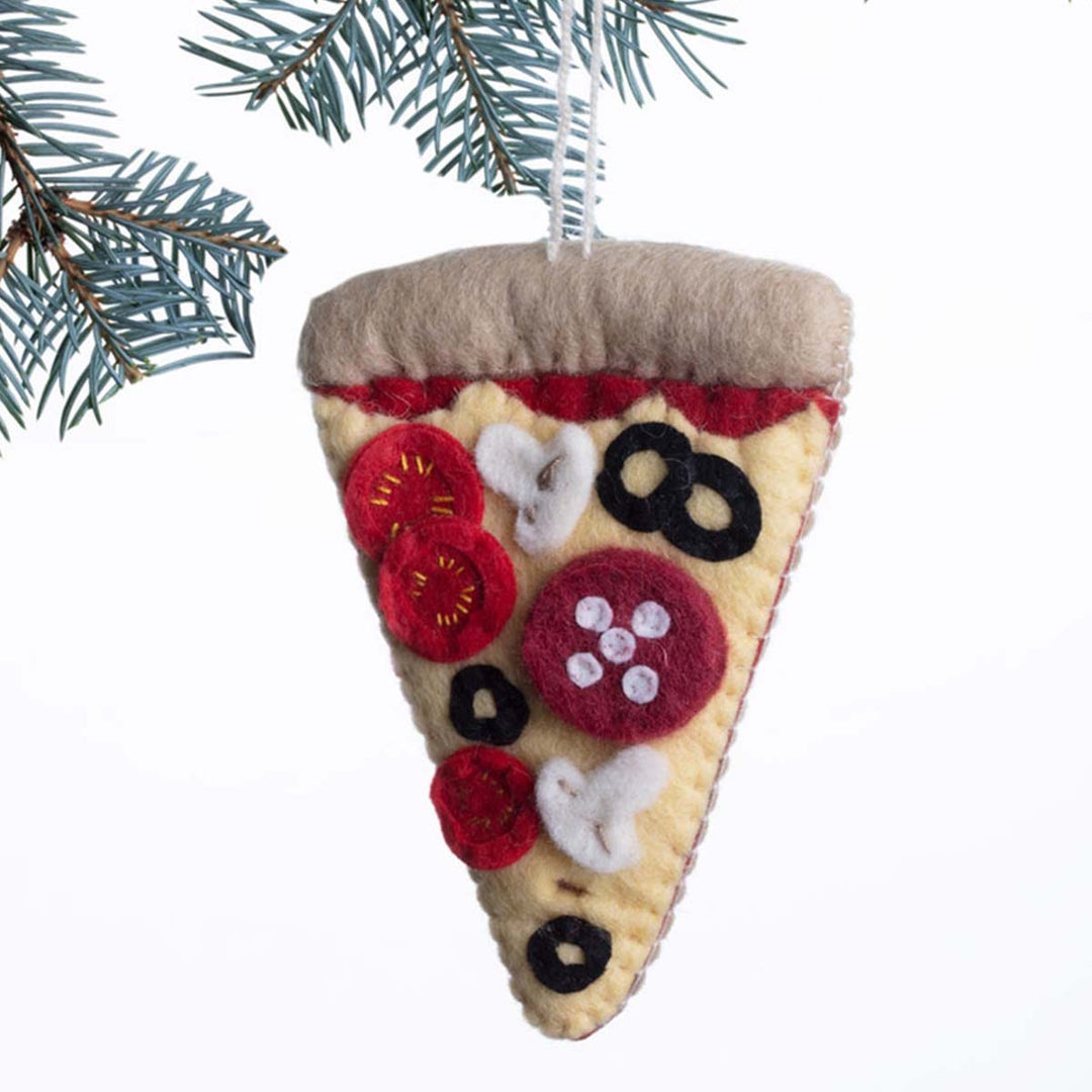 Felt pizza slice ornament hanging on a Christmas tree branch.