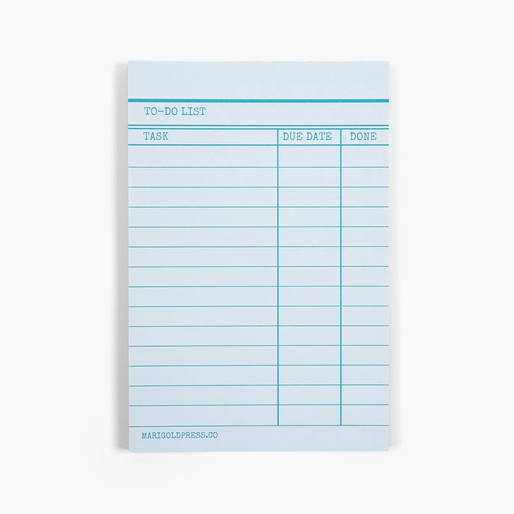 A light blue to-do list notepad with lined pages and printed columns for task, due date, and done status, shown on a clean white background.
