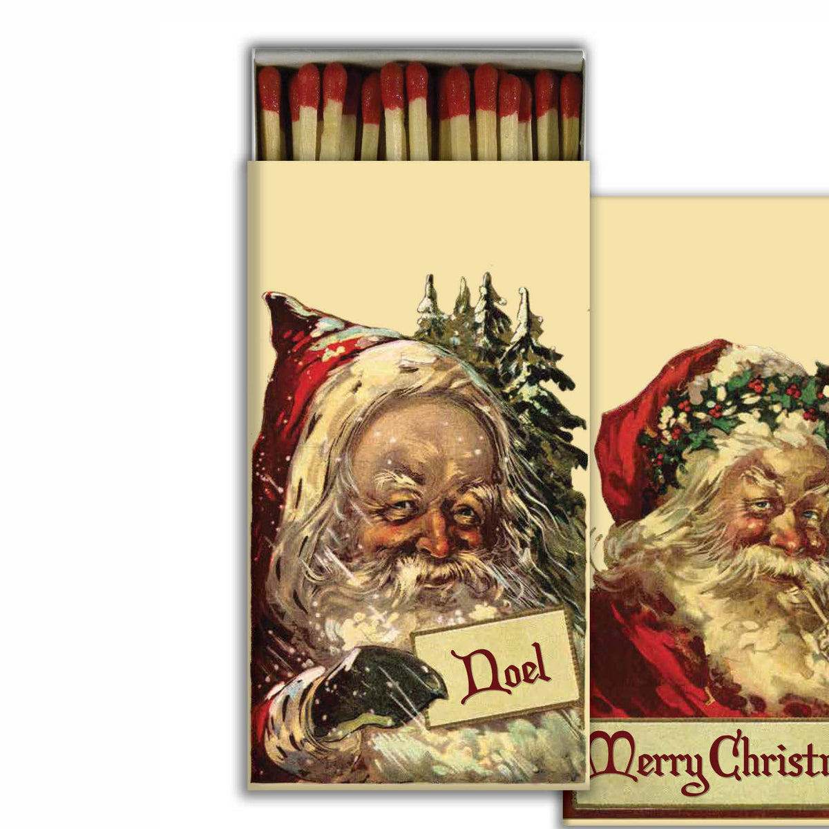 A Christmas-themed matchbox with red matches visible at the top and a vintage Santa illustration on the front. The matchbox is shown slightly open, with a second matching decorative card or insert partially visible behind it on a white background.