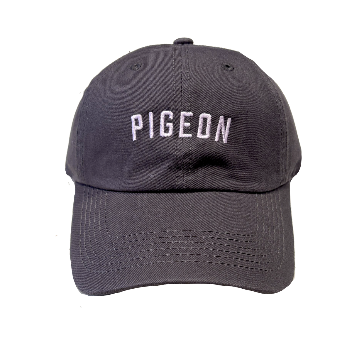 A dark gray baseball cap with the word 'PIGEON' embroidered in white arched letters on the front, shown against a plain white background.