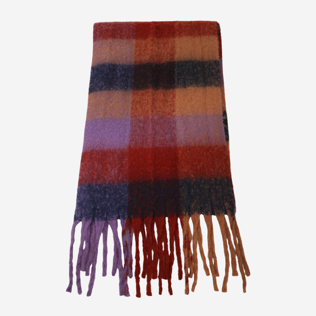 A folded plaid scarf with fringe tassels, featuring colors of rust red, orange, brown, purple, and black on a light gray background.