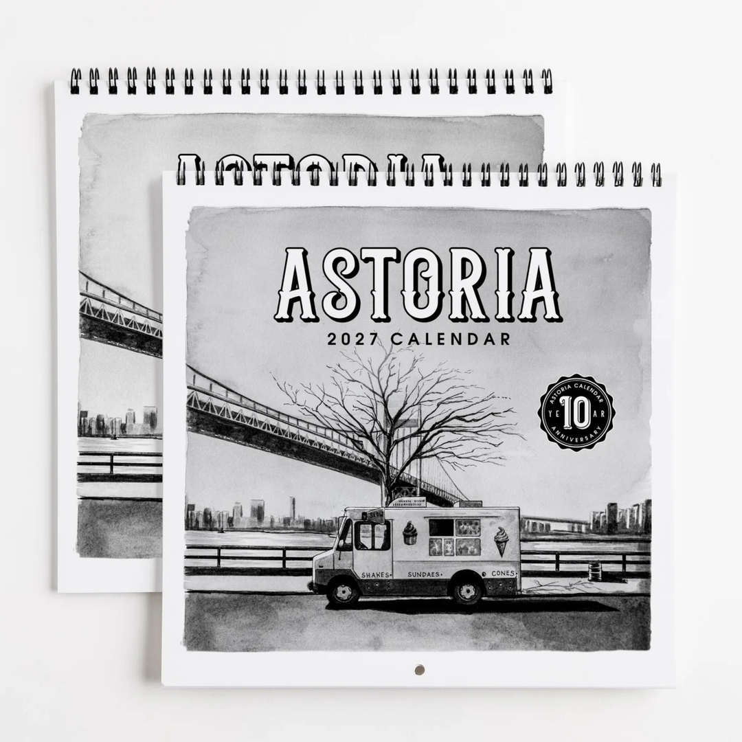 A spiral-bound 2027 Astoria calendar shown in a stacked layout. The cover features a black-and-white illustration of an Astoria ice truck, a leafless tree, and a bridge over water, with the text &