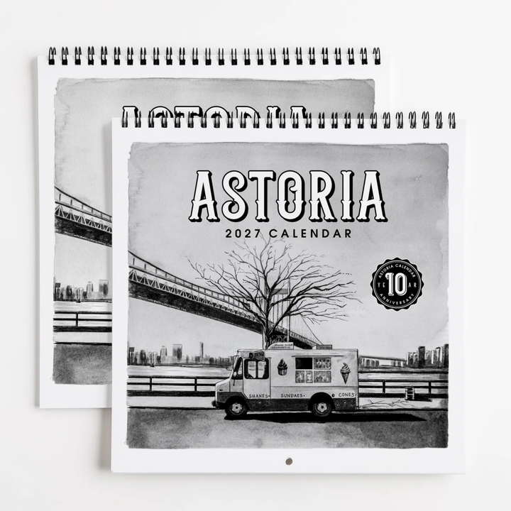 A spiral-bound 2027 Astoria calendar shown in a stacked layout. The cover features a black-and-white illustration of an Astoria ice truck, a leafless tree, and a bridge over water, with the text &