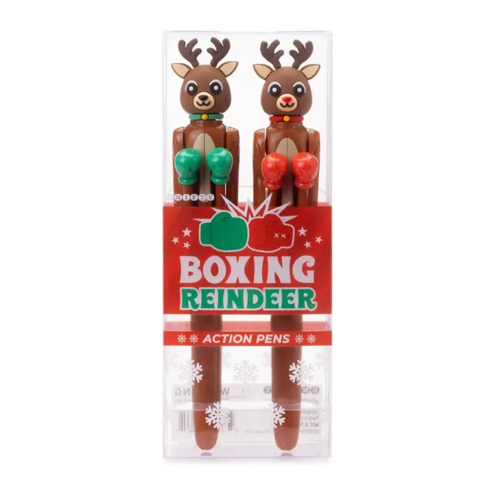 A pair of novelty boxing action pens shaped like brown reindeer with green and red boxing gloves, packaged in a clear plastic case with a red &