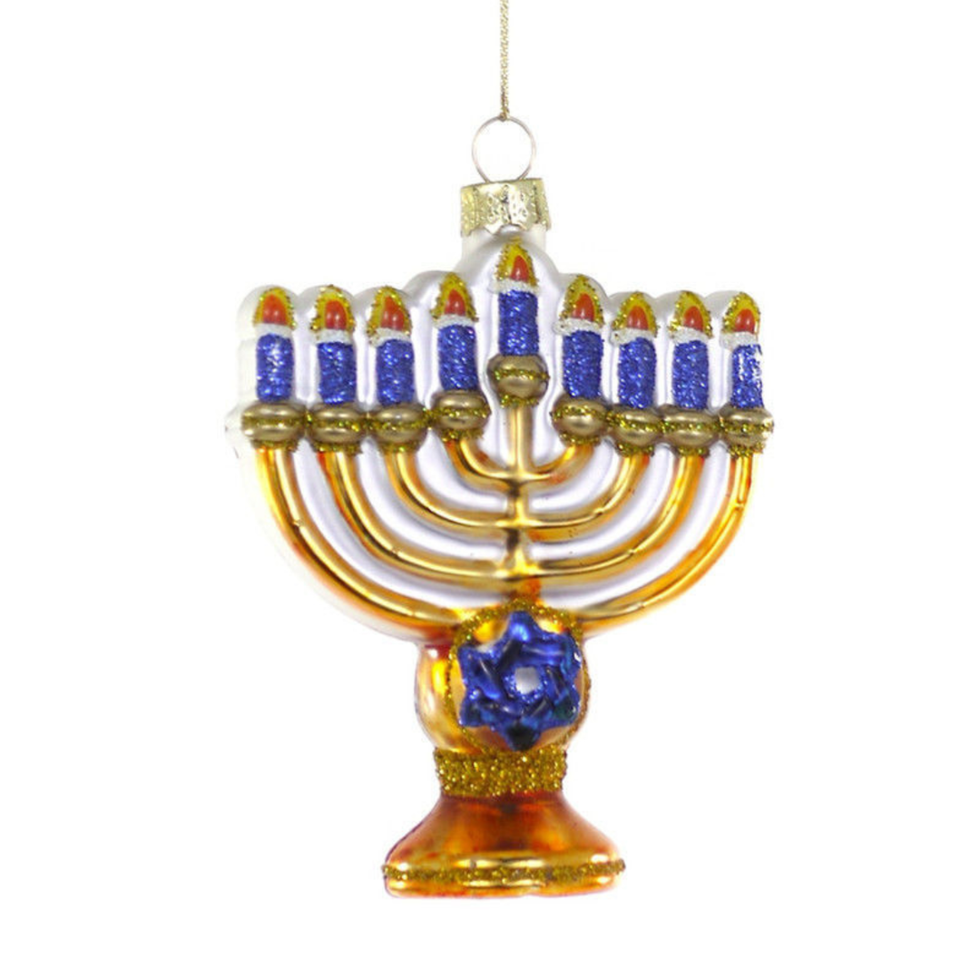Decorative Menorah ornament with blue candles on a white background