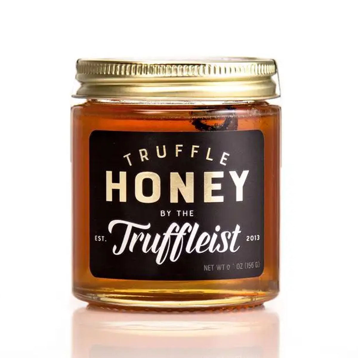 A jar of Truffle Honey by The Truffleist with a label showcasing the brand and product name, against a white background.