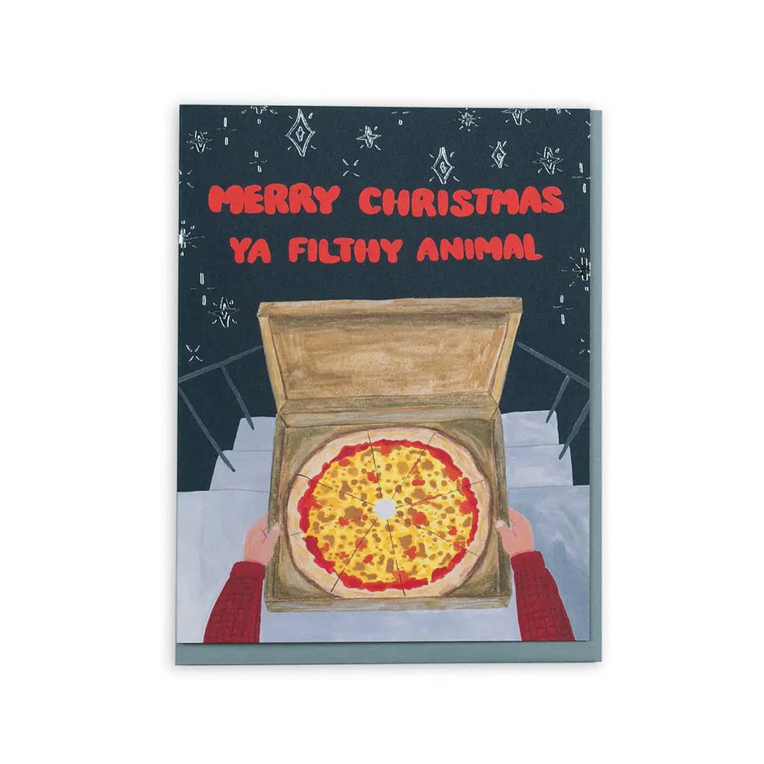 A Christmas greeting card featuring a humorous illustration of a pizza box with the text &