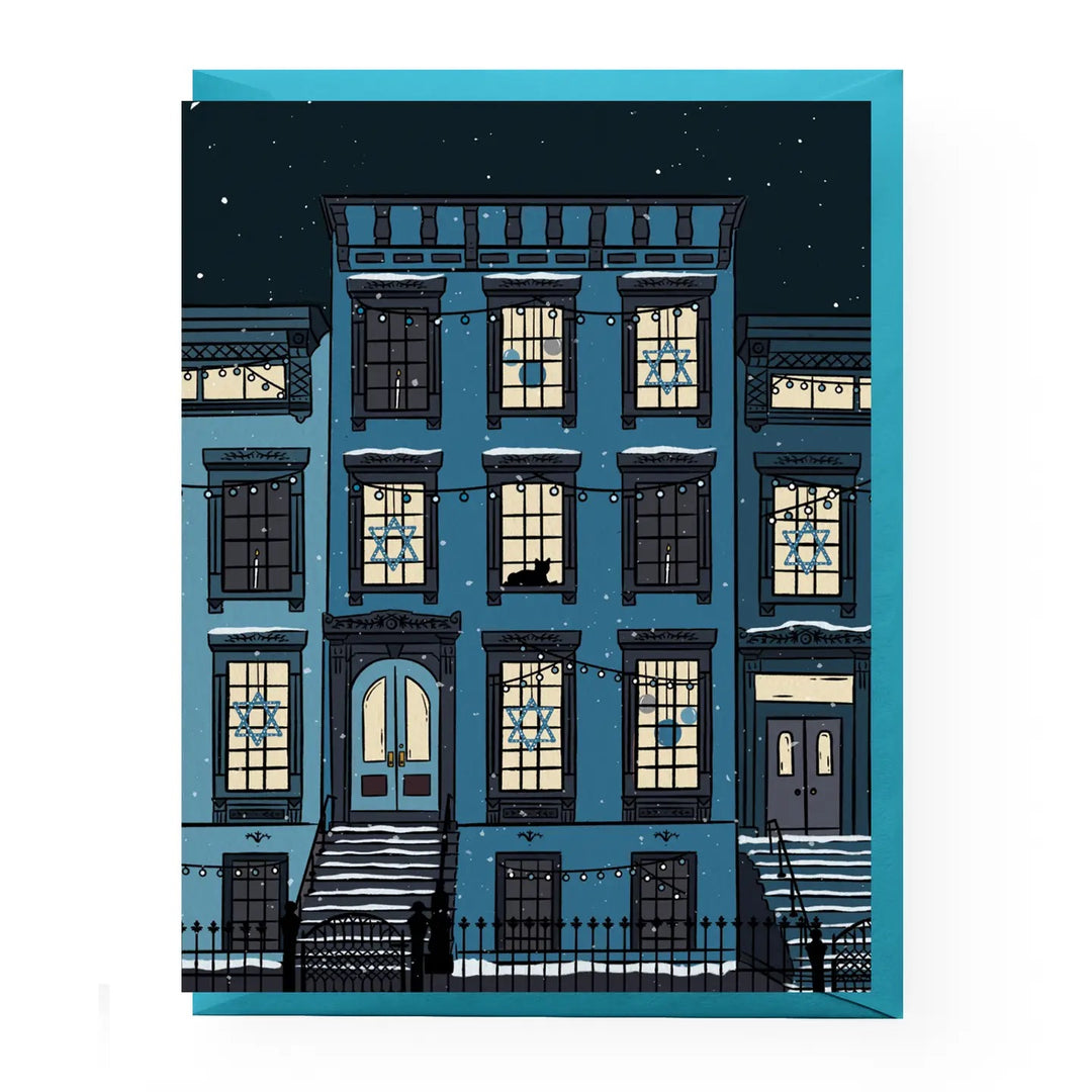 Illustration of a snowy street with apartment buildings at night.