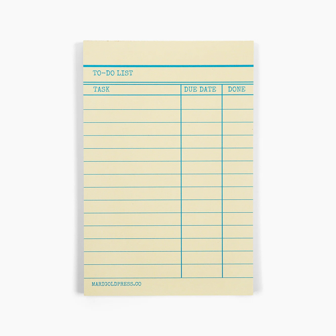 A single lined to-do list notepad with a cream-colored paper background and teal blue printed lines and text, shown on a clean white background.