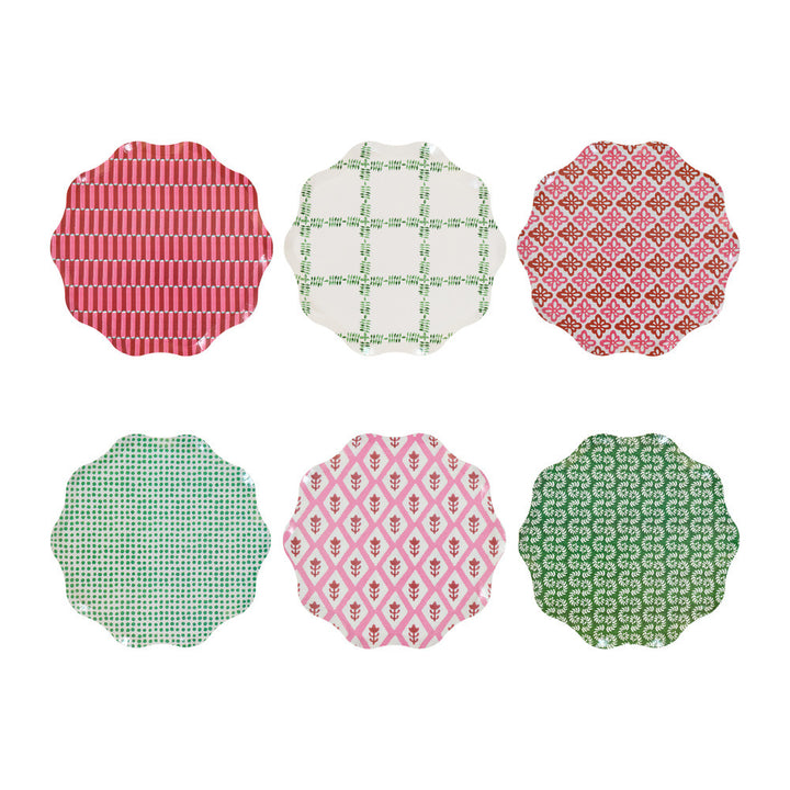 Six scalloped-edge round plates arranged in two rows of three on a white background, each with a different colorful pattern including stripes, lattice, floral, and geometric designs.