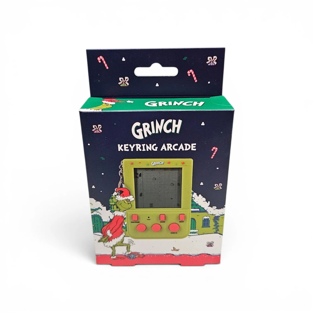Grinch Keyring Arcade in its original retail packaging, featuring a Christmas-themed box with illustrations of the Grinch and candy canes on a white background.