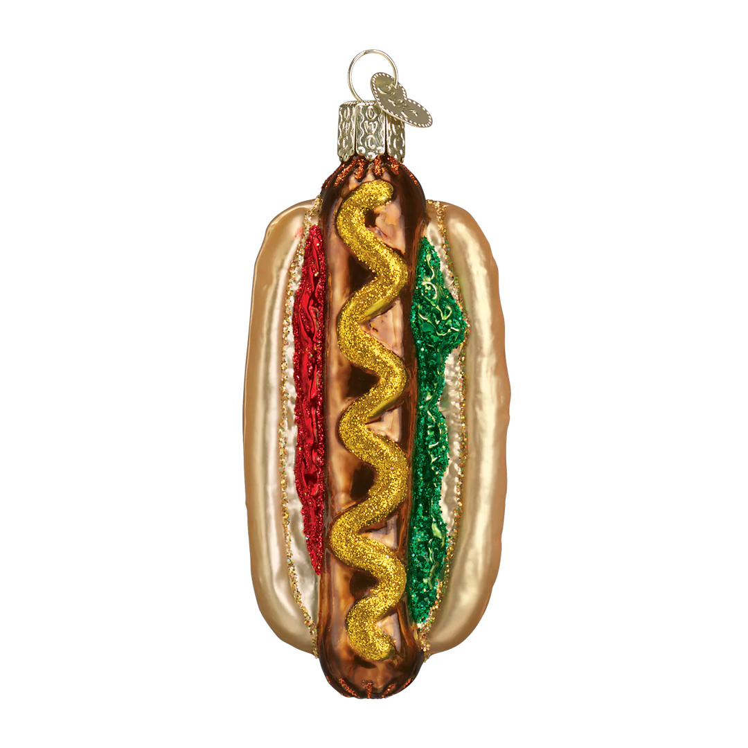 Hot dog ornament hanging on a white background.