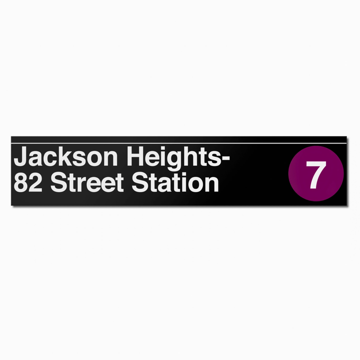 A rectangular black street-sign style plaque reading &
