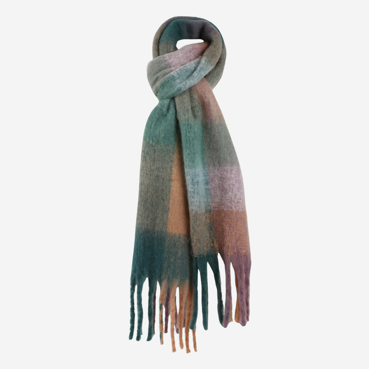 A soft, fuzzy scarf with a plaid pattern in teal green, dusty pink, and warm brown, finished with fringed ends, shown on a plain light gray background.