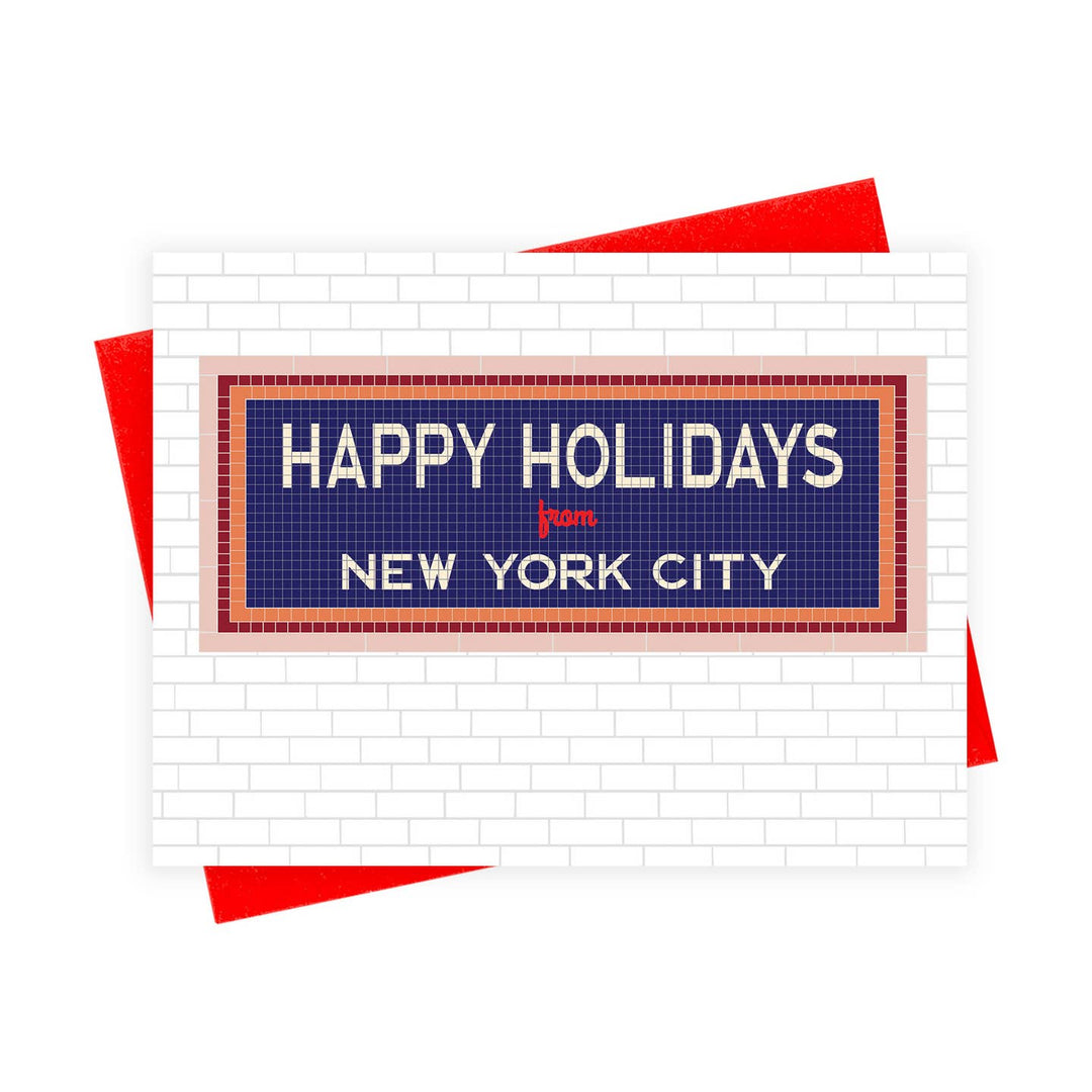 A holiday greeting card featuring a New York City subway station sign design that reads &