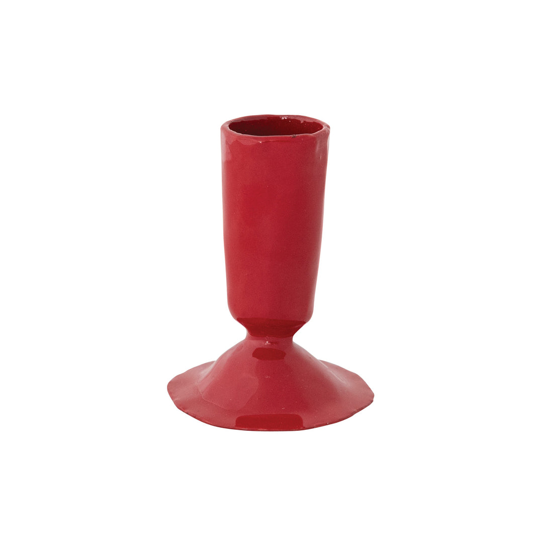Red candle holder on a white background