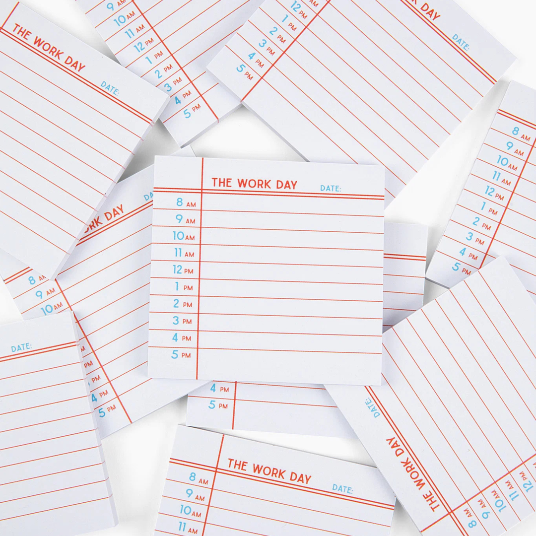 A pile of white notepads with red horizontal lines and blue printed time slots under the heading &