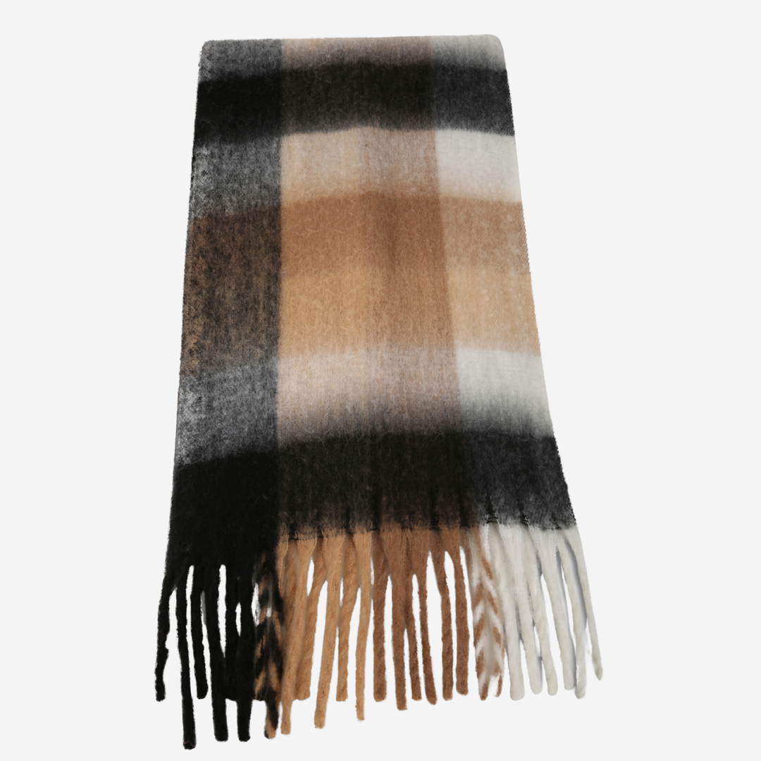 A classic plaid scarf with fringe tassels, featuring stripes of black, gray, beige, and white, displayed flat against a light gray background.