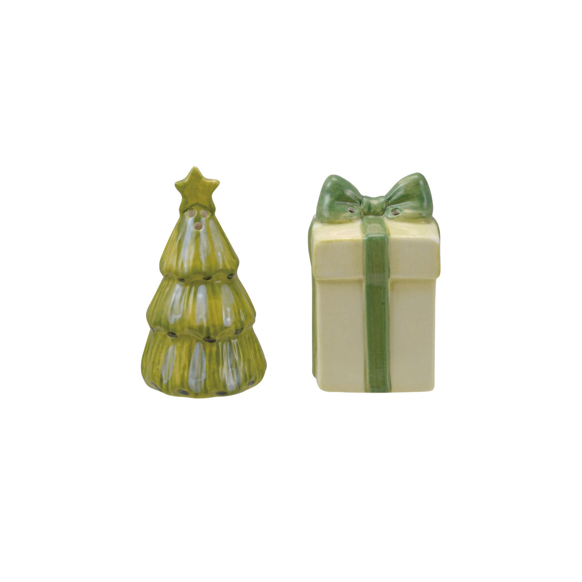 Two ceramic shakers on a white background. One is shaped as a a green Christmas tree with a gold star on top and a cream-colored gift box with a green ribbon and bow. 