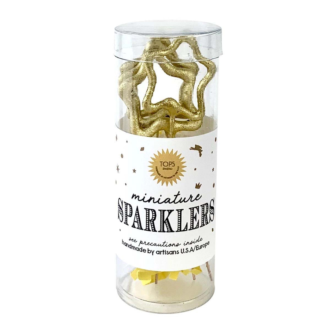 Plastic container holding star-shaped miniature sparklers.