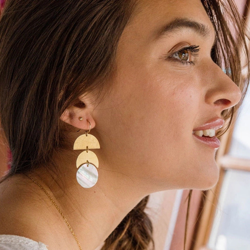 Luz la Luna Earrings - woman I profile wearing gold dangle earrings - Lockwood Shop - Amano